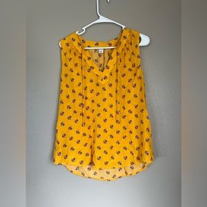 Yellow sleeveless blouse